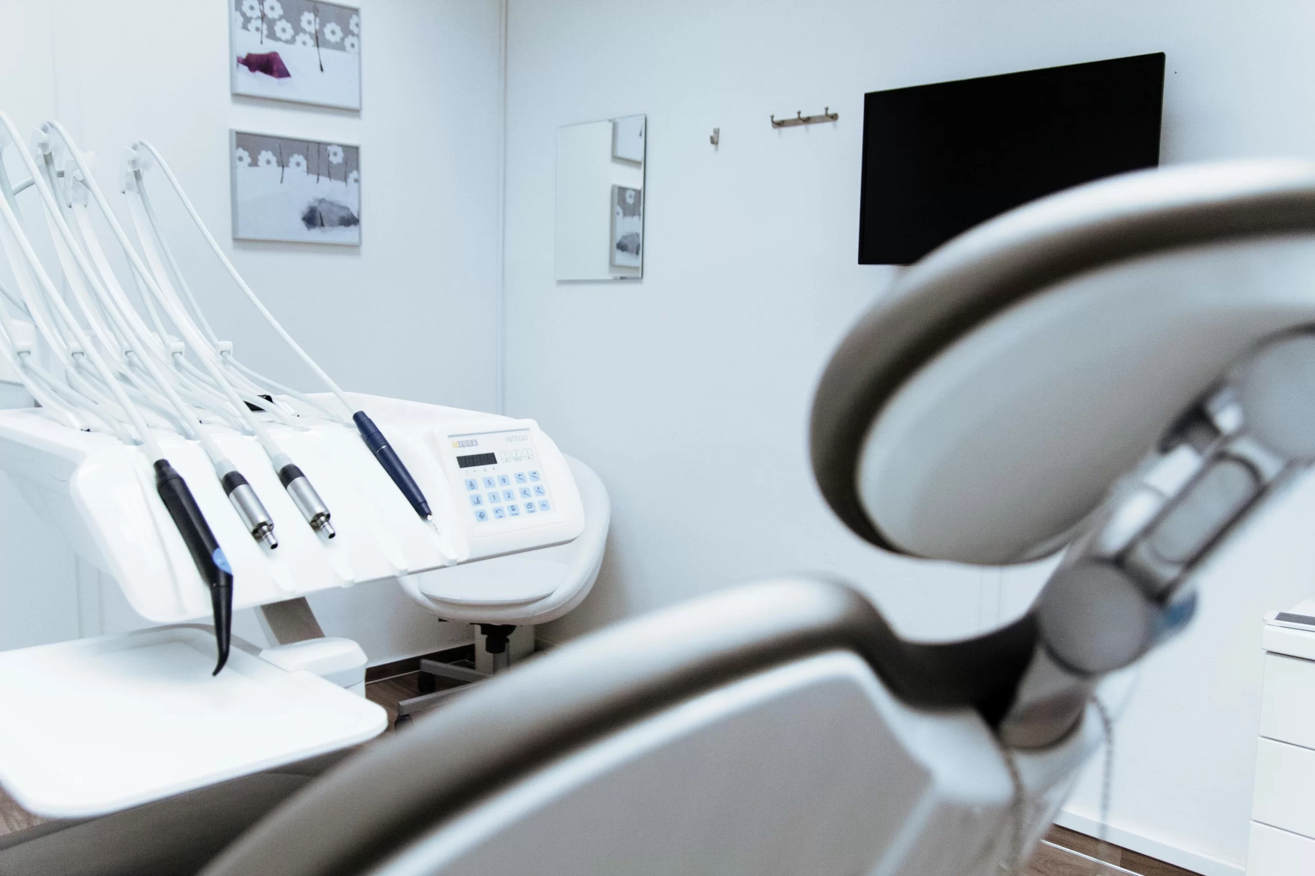 pexels-photo-305568 View of a dental chair with dental equipment in the background
