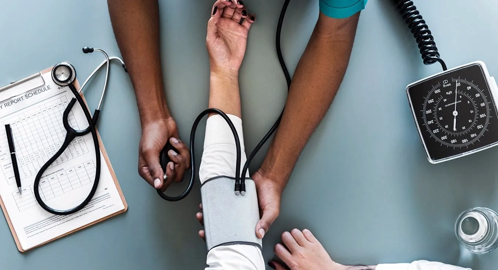 bp-closeup Overhead view of patient having blood pressure taken